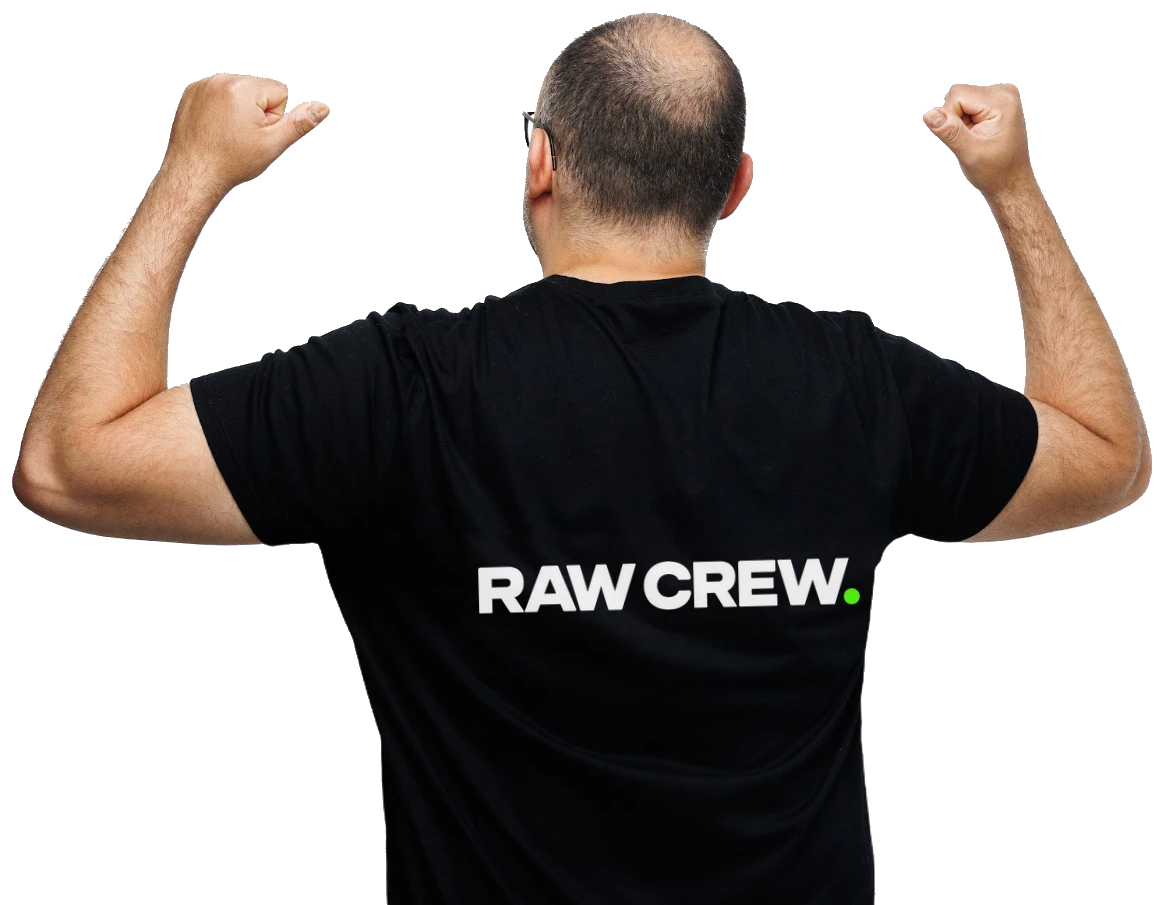 Fred wearing a RAW CREW shirt, viewed from behind with both arms raised.